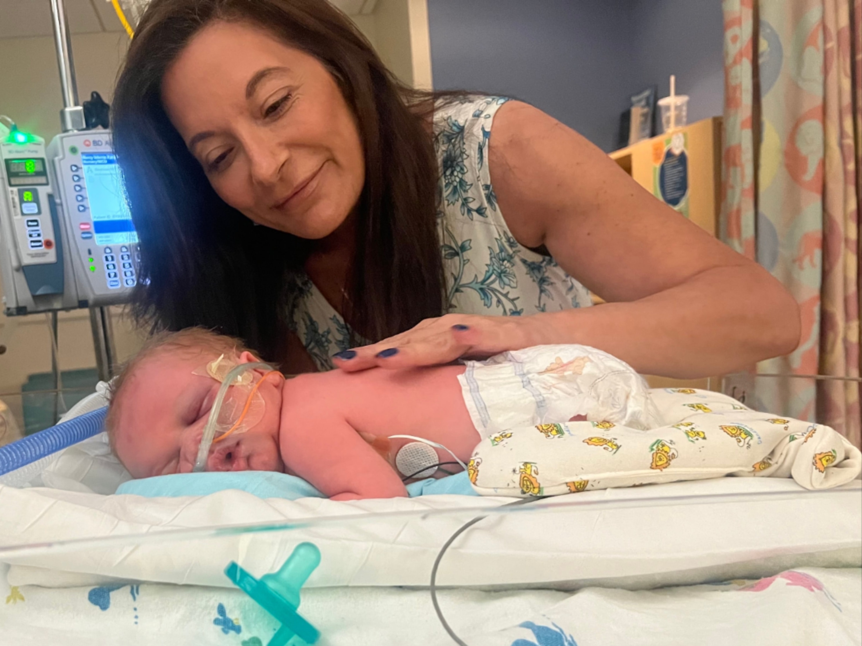 Susan with her grandson in the hospital — the moment that inspired Everclose Jewelry